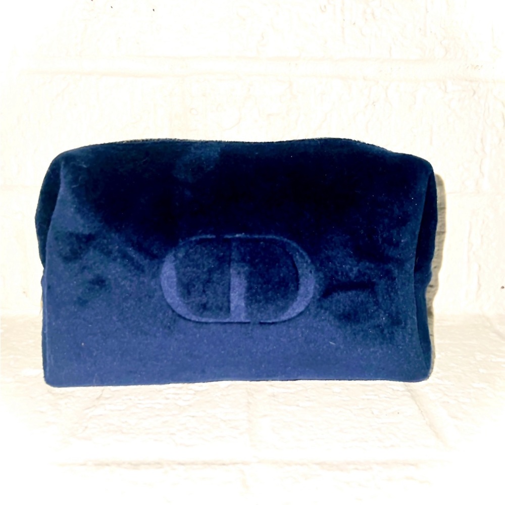 Blue velvet DIOR make up bag.